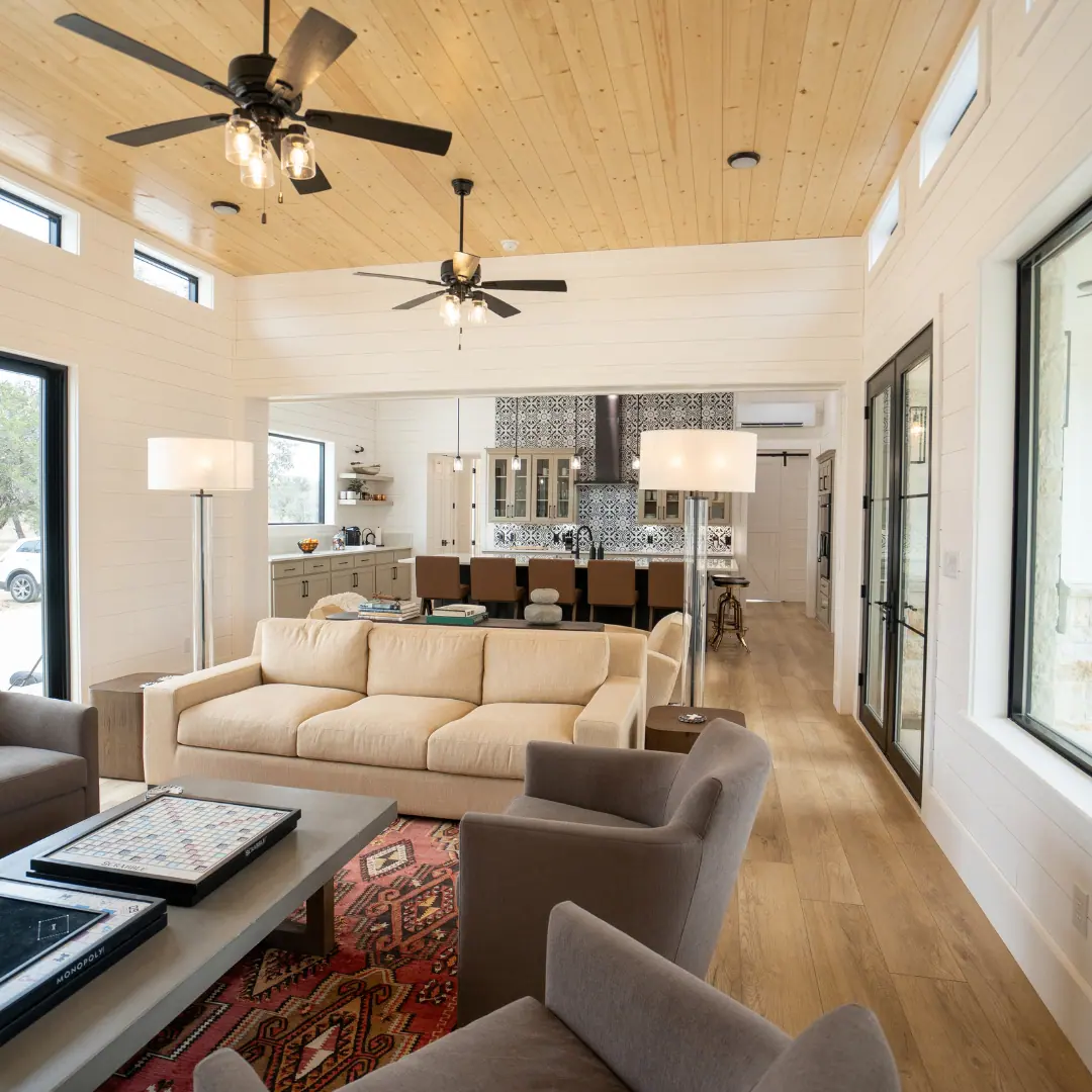 Living area with wood ceiling and full-height windows