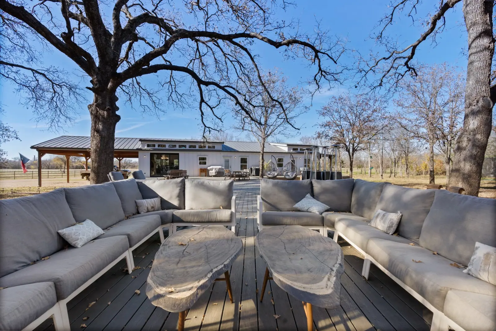 Deck lounge with sectional seating and live-edge tables