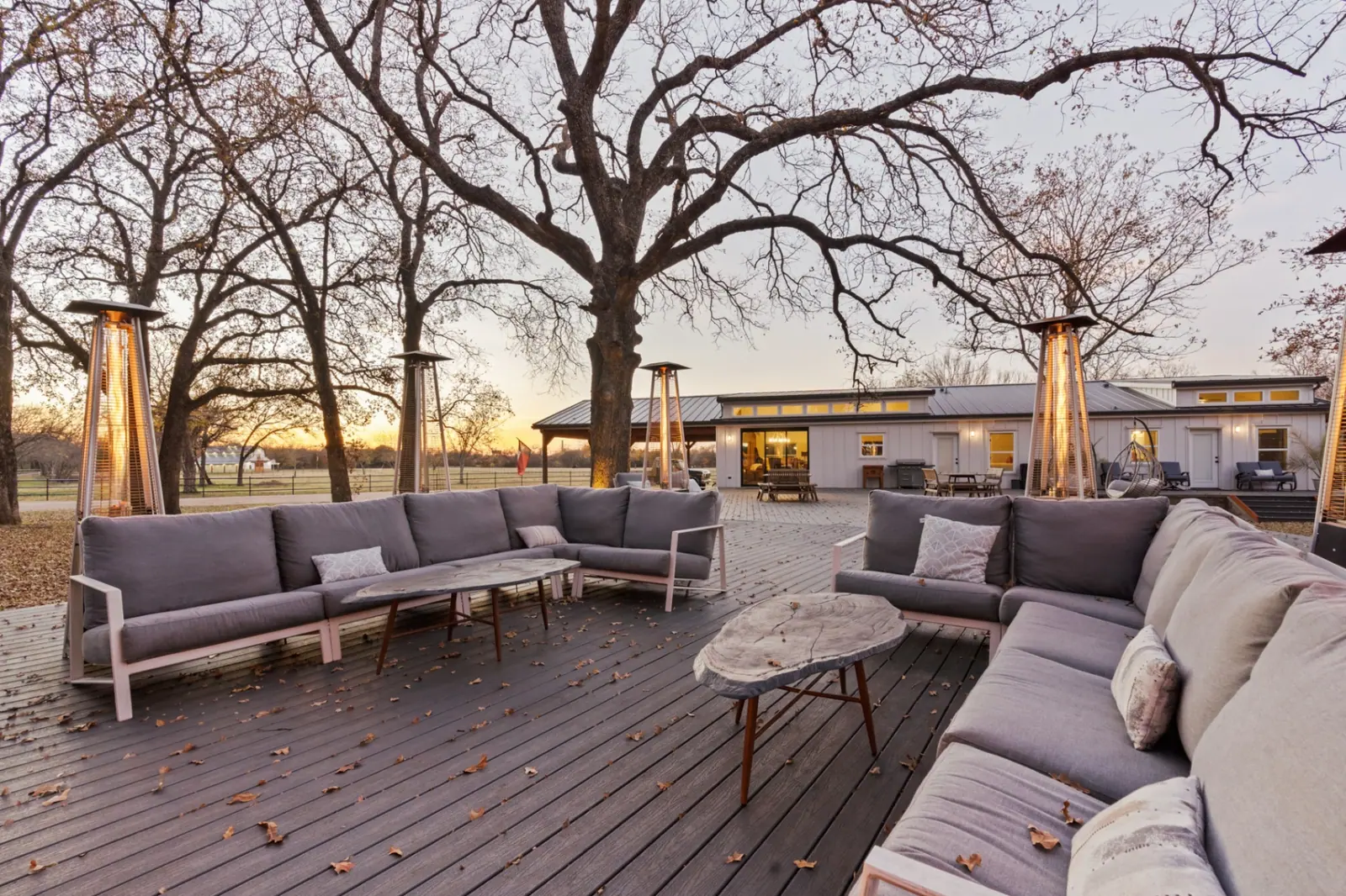 Expansive deck with lounge seating at sunset
