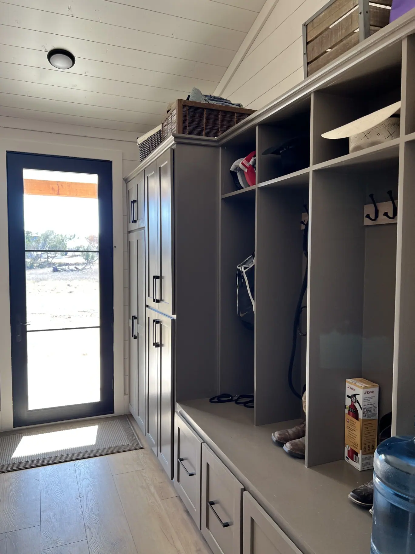 Mudroom with built-in lockers, bench and storage cabinetry