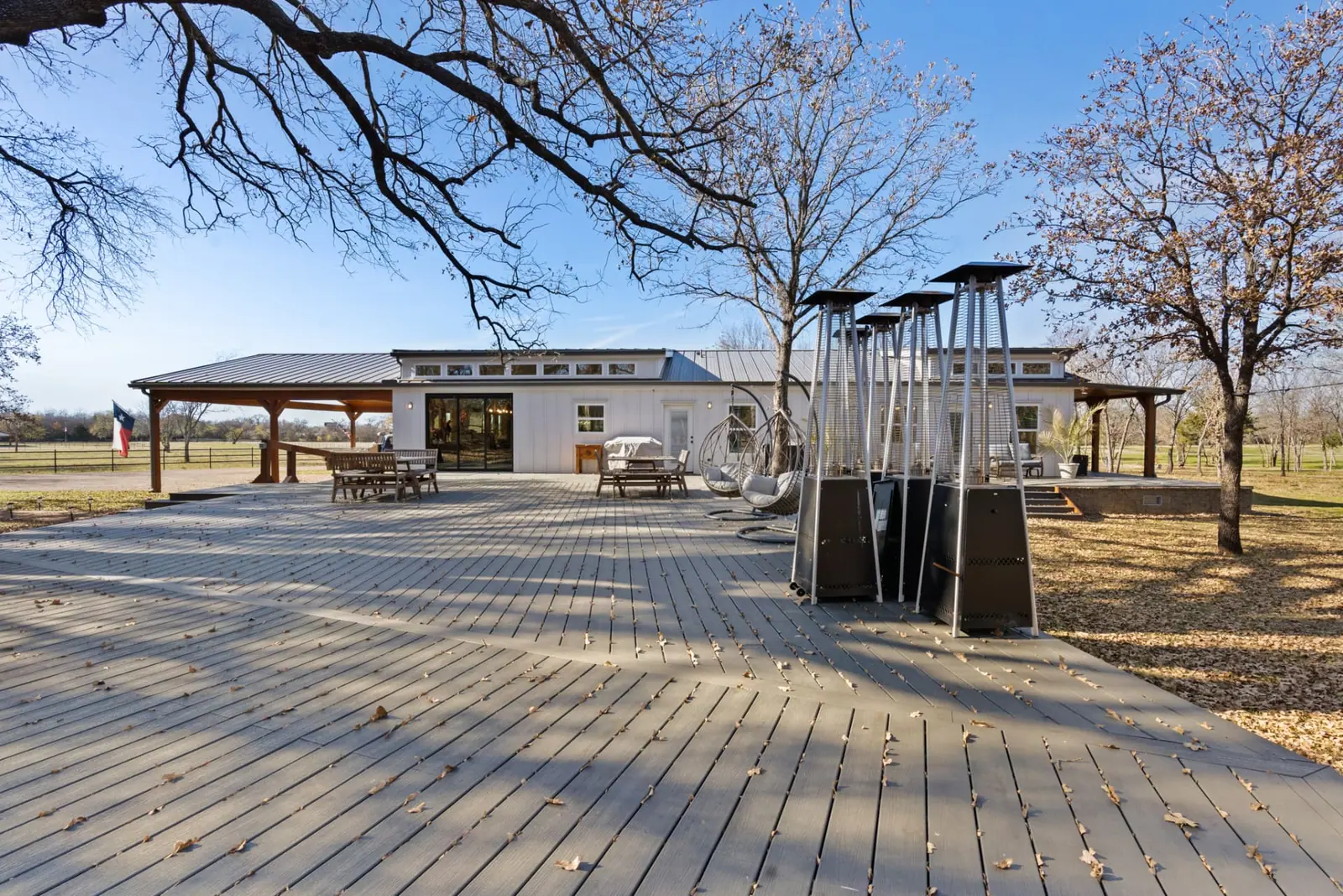Expansive composite deck with pavilion and outdoor dining
