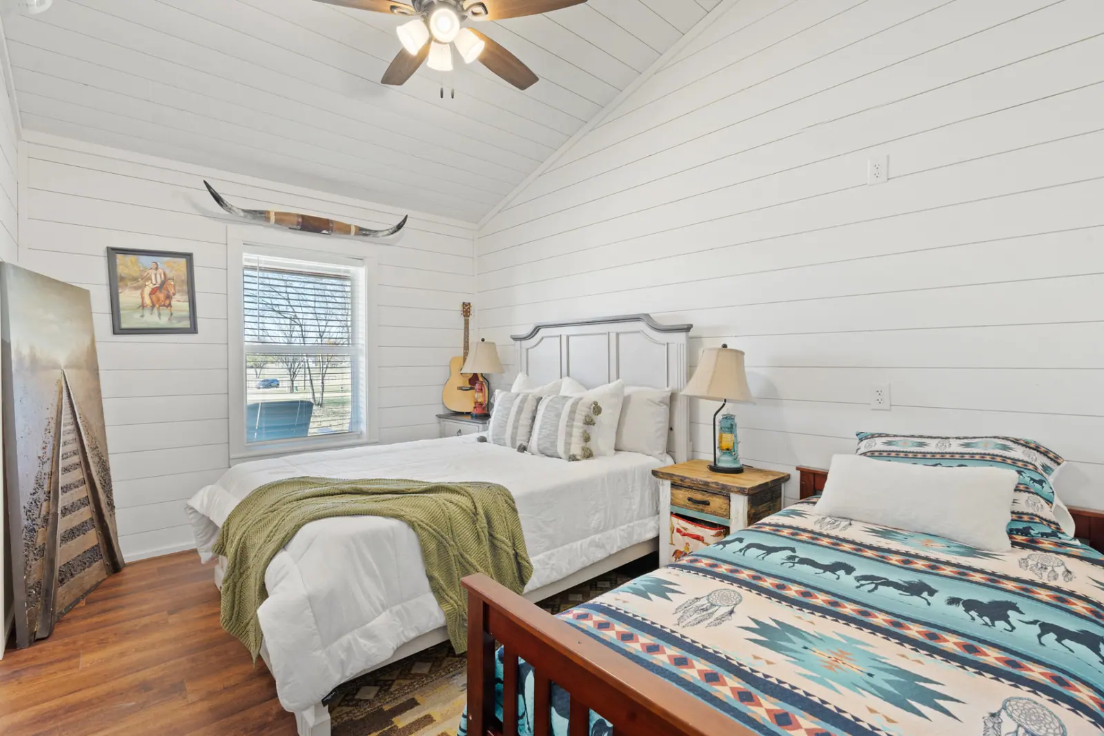 Bunk-style guest room with two beds and southwestern bedding