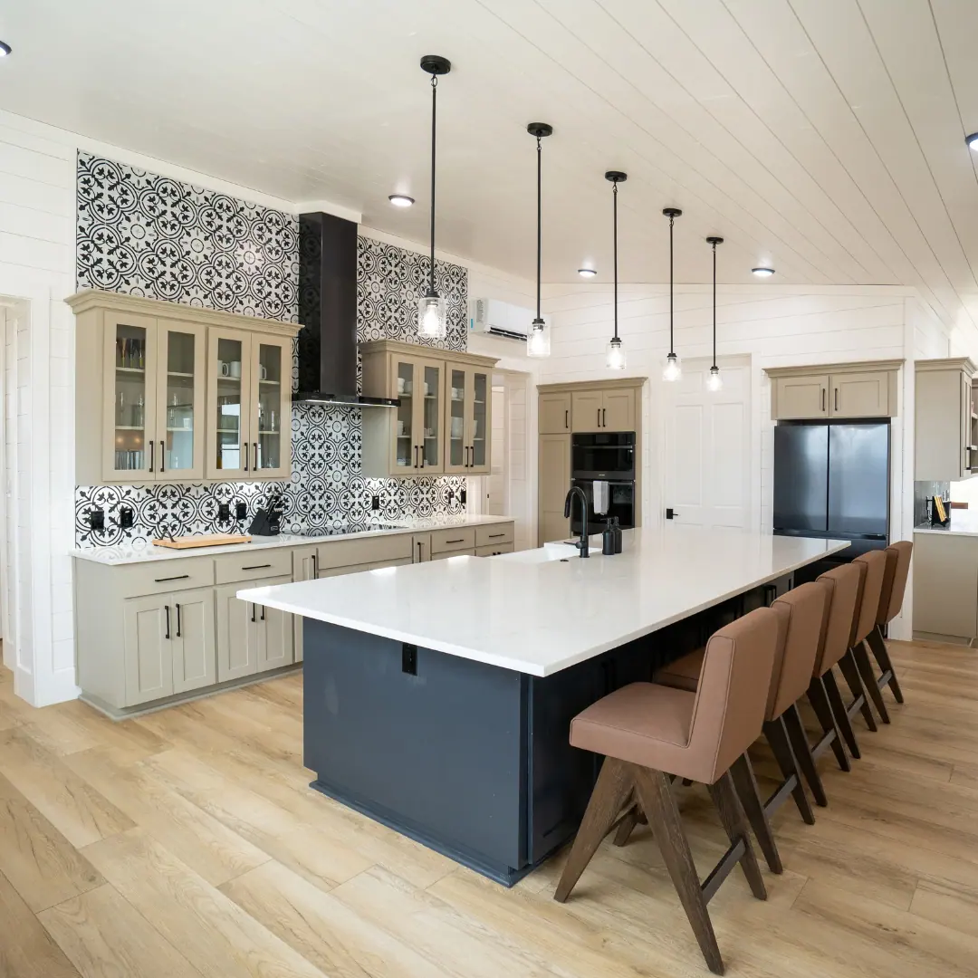 Open kitchen with long island and patterned tile backsplash