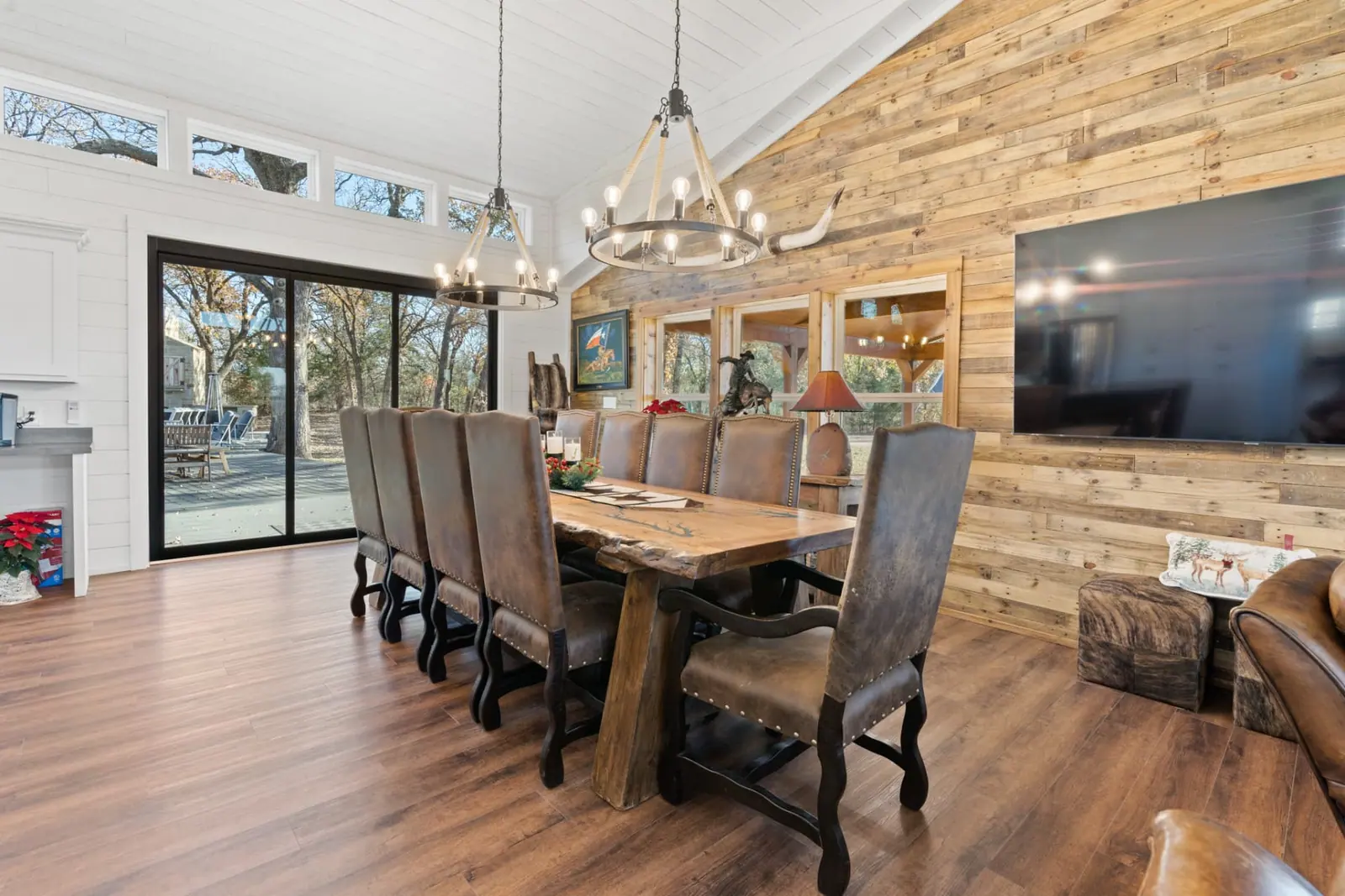 Dining room with live-edge table and twin rope chandeliers